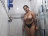 Hot colombian girl with big boobs takes a shower on webcam