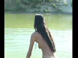 Mongolian beauty pissing in the water