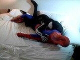 skeleton humps spiderman on his white bed