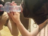 Amateur in Latex Hood Blowing a Dildo