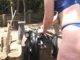 Mistress playing with her slave outdoors