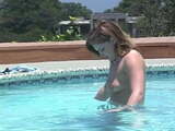 Horny female coeds swim topless and play with each other in pool