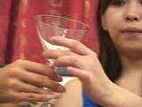 Two sexy Japanese women spit in a glass and...