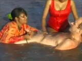 2 Indian girls with white guy in beach have fun blowjob.. 