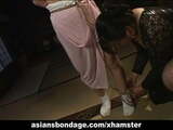 Asian babe in rope bondage scene