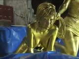 Queen tortures gold painted slave