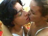 Lizandra giving a deep kiss to her wife before bed