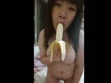 Chubby Asian orgasms off of unpeeled banana