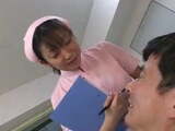 Japanese dentist and nurse spitting on patient